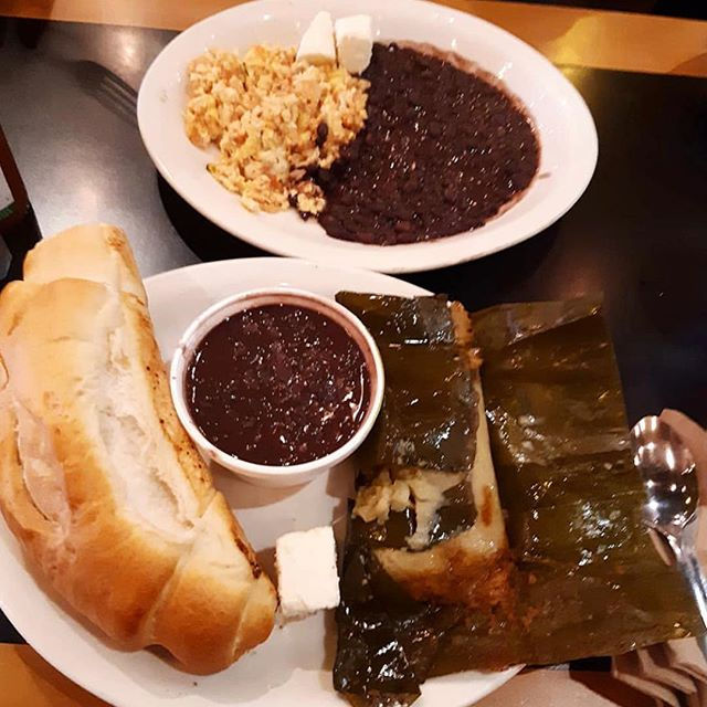 Two plates of an Antigua Bread Meal with Beans and Rice